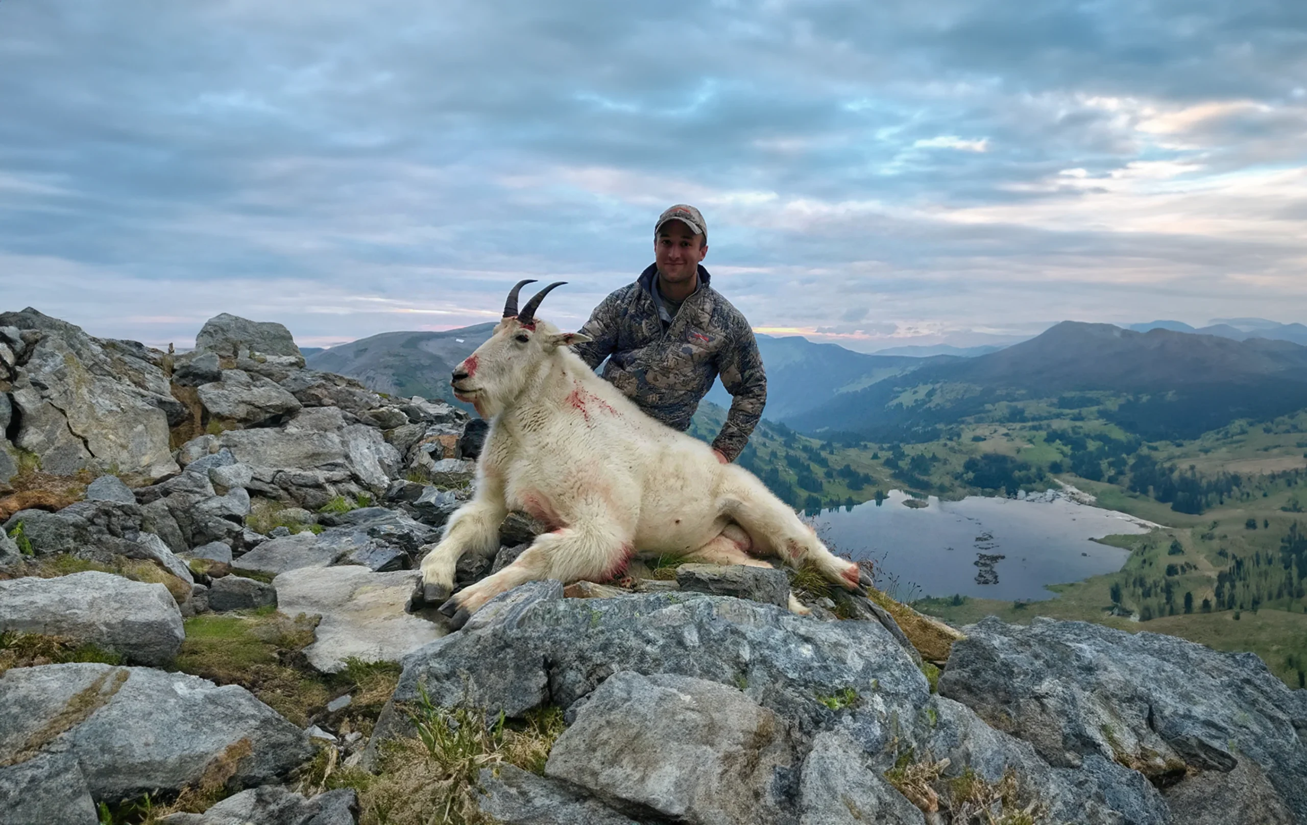 A person with a mountain goat