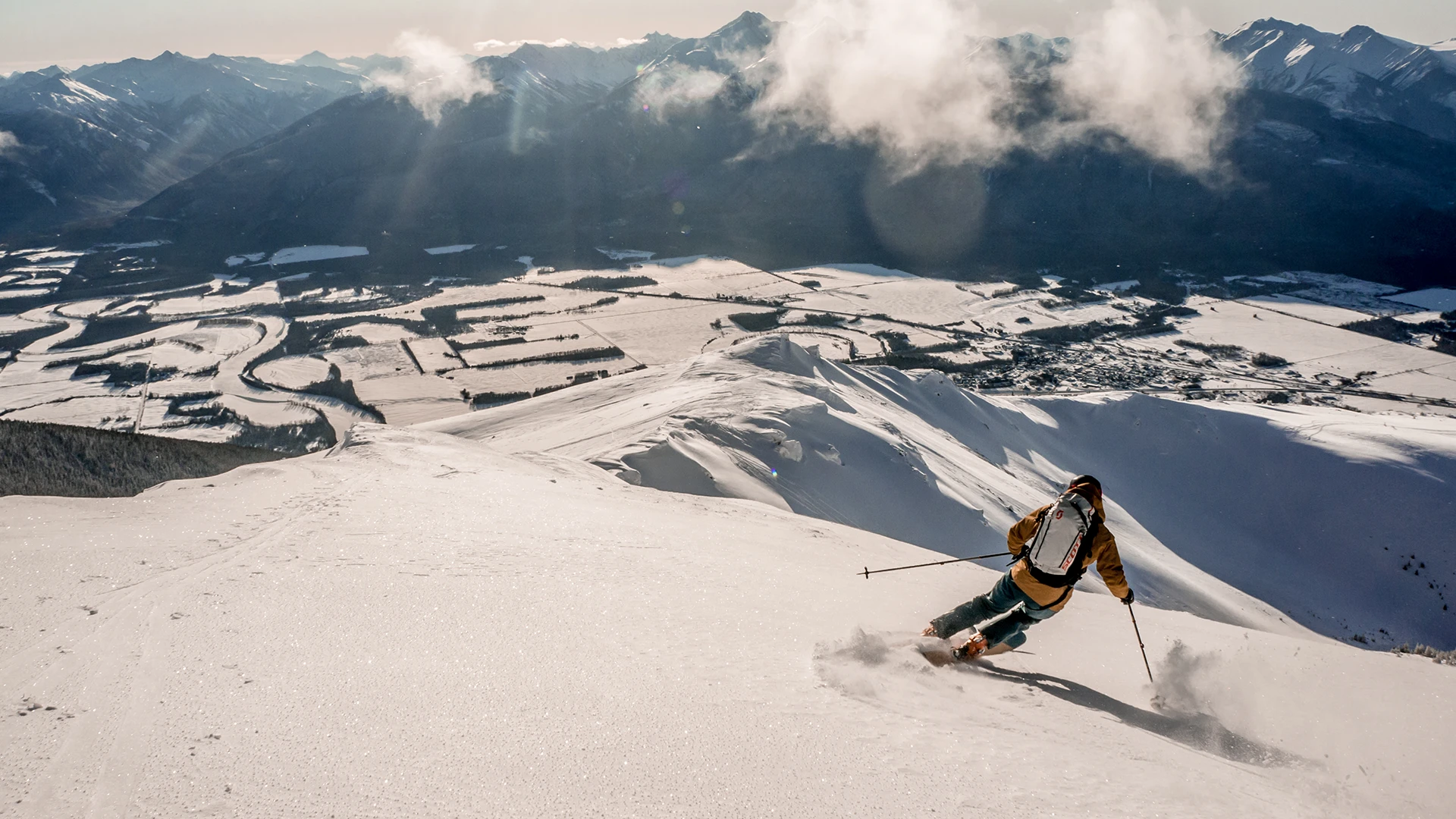 A person skiing on a snowy mountain